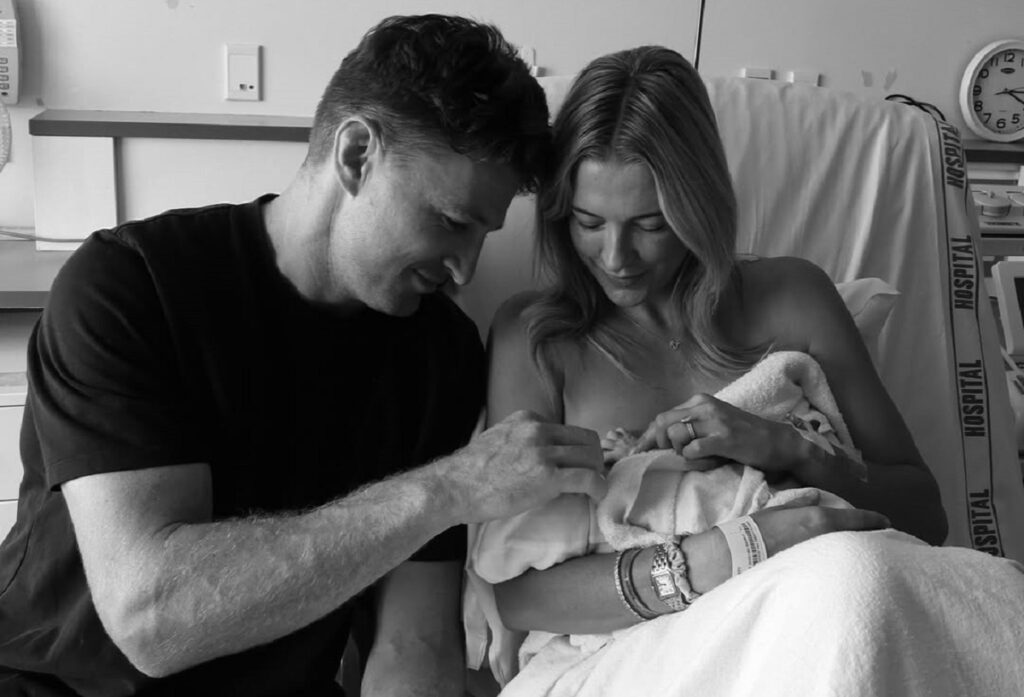 Beauden Barrett, his wife Hannah and their baby