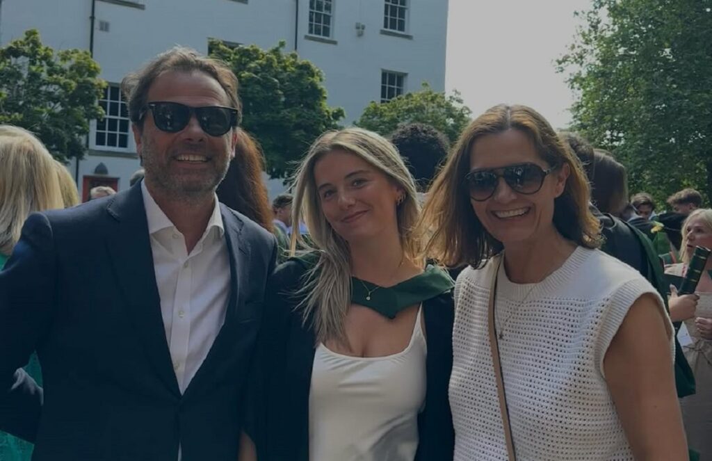 Gracie Hand and her parents on graduation day