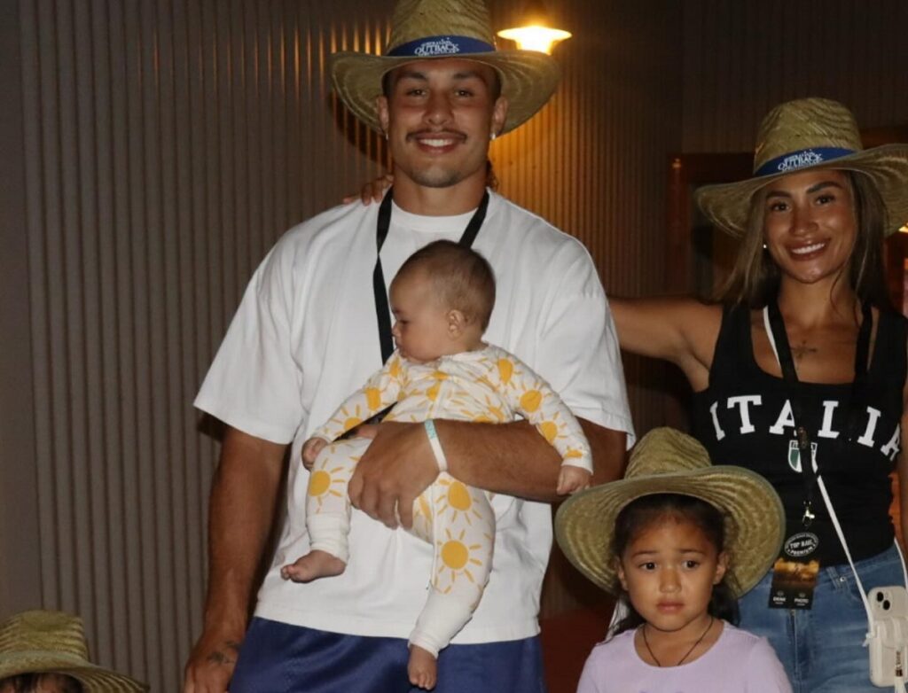 Tino Fa'asuamaleaui with his partner and his children